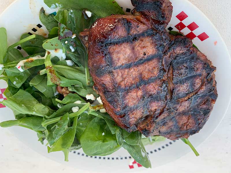 Rib Eye with spinach salad.