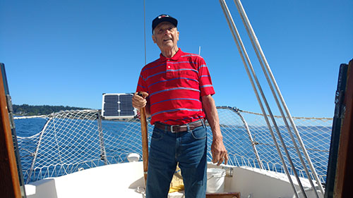 Dad's at the helm as we raise the sails. Keep her into the wind Admiral!