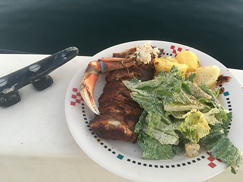 Surf n' turf for dinner. Ribs, crab, spuds and caesar salad.