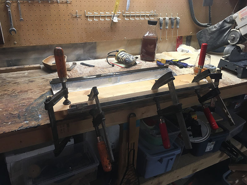 No problem flattening the stainless. It's still a little curved but that's desireable.