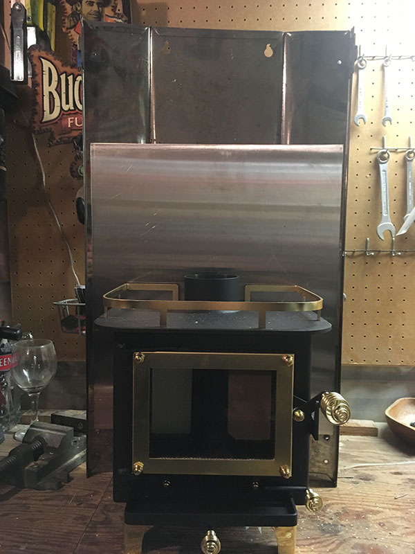 A new piece of stanless sheeting between the stove and the heatshield. Stove is bolted to both.