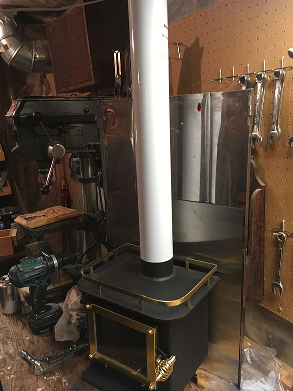 With stainless steel stove pipe attached.