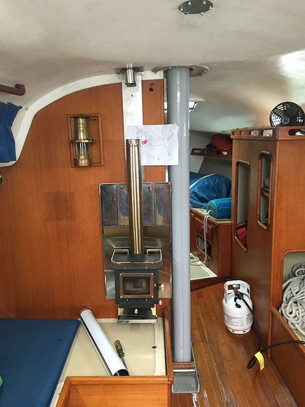The whole unit, stove and heat shield, hang on the bulkhead by four screws. We'll find out if this is a good thing or a bad thing in the days and weeks ahead!