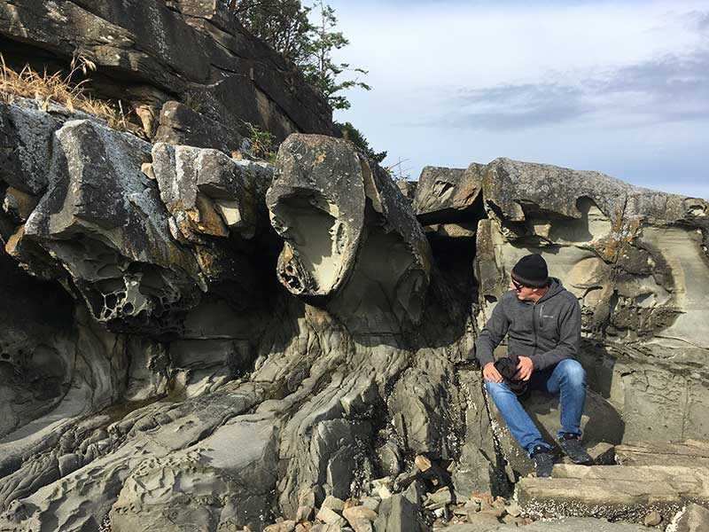 Eric examins the petrified remains of an alien pod.