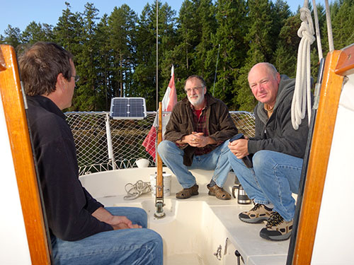 Eric, Tom and Kevin enjoy coffee at Montague Harbour.