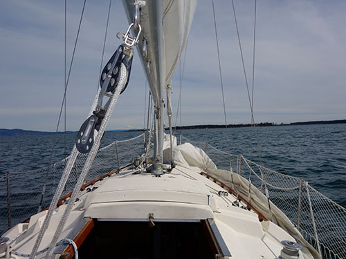 Beating East toward Chatham Island with Mt. Baker in the distance. Note jenny on the deck.