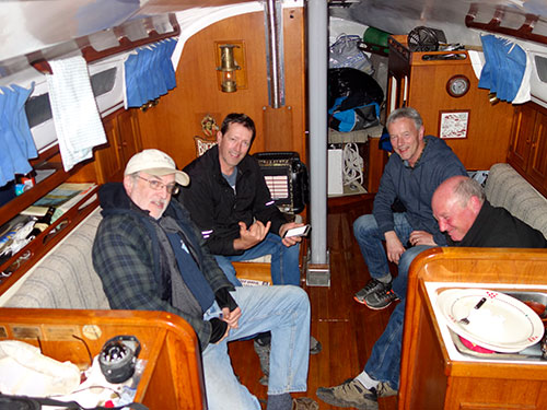 The crew relaxing below deck on T2 at Wallace Island.