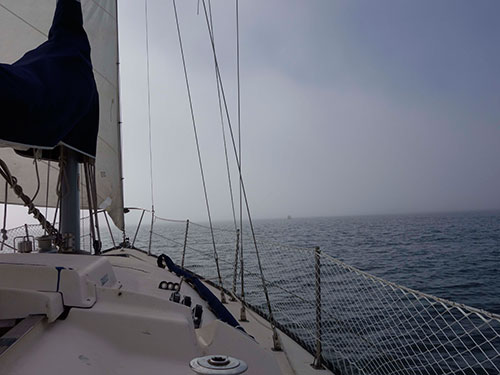 Committee boat off the starboard bow. Setting marks for the day's racing.