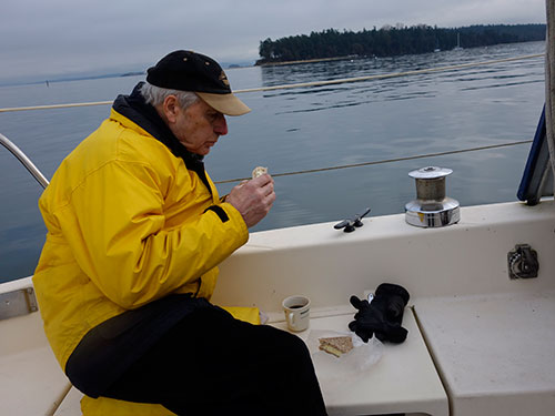 Dad enjoys his sandwhich and coffee