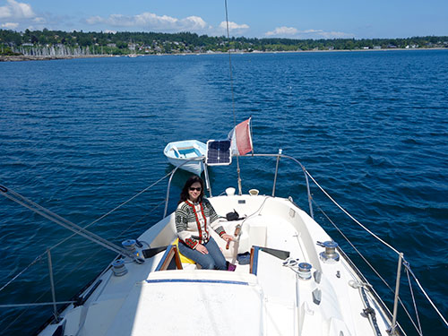 Tania at the helm under main sail and genny.