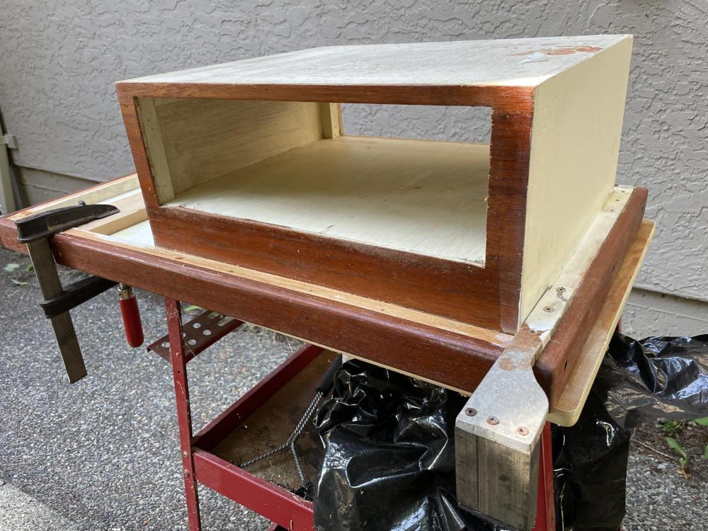 I cut  the back of the drawer out and simply slid the drawer in from the other side.